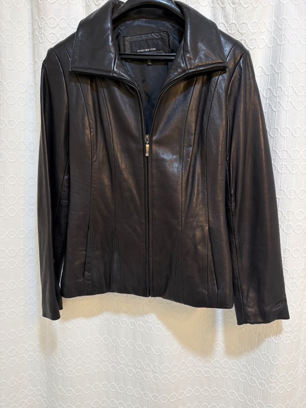 Hip length black leather jacket. Size Medium